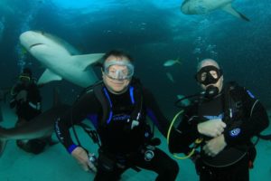 Dr. David LeMoine scuba diving with sharks